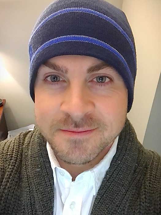 Matt Feldman wearing a striped blue beanie.